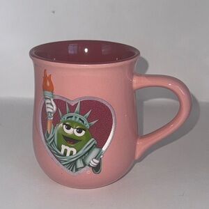 M&M'S Pink statue of Liberty and chocolate for all mug Mug with green m&m